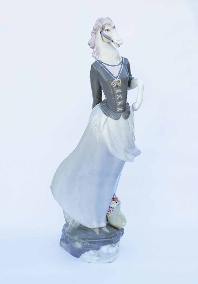 Escape from the Carousel, 2022 Secondhand ceramic figurines and mixed media	 14” x 5” x 6”	 $800